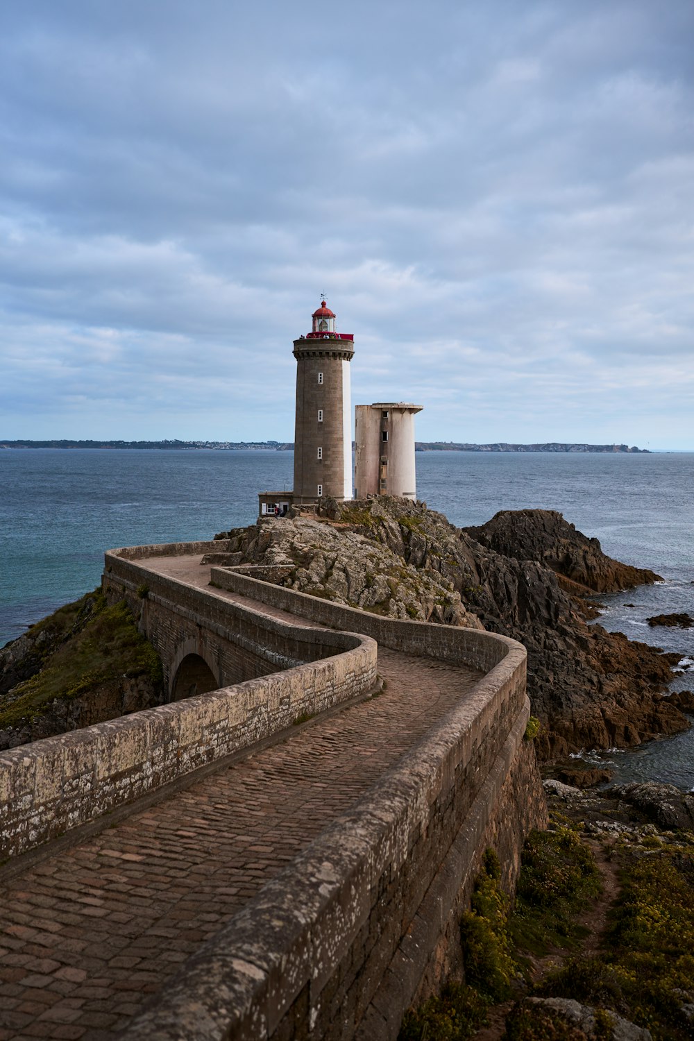 a light house sitting on top of a rocky cliff