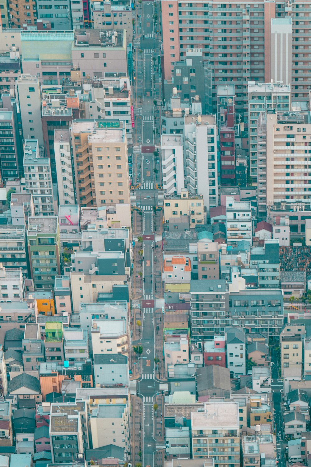 an aerial view of a city with tall buildings