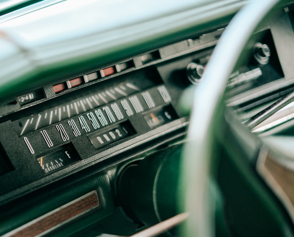 a car dashboard with a dash board and a steering wheel