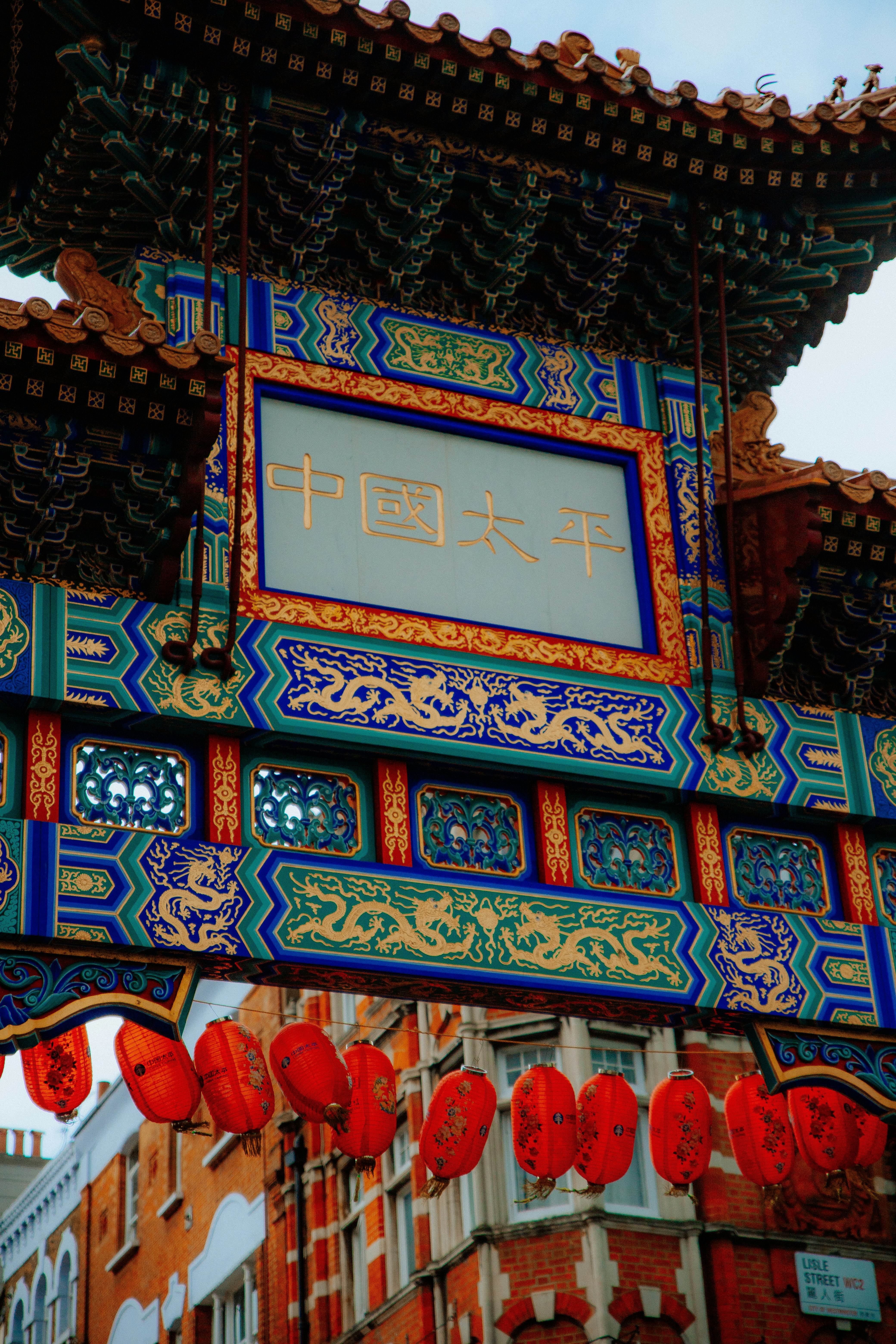 a building with a sign hanging from it's side