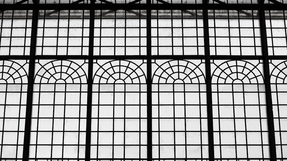 a black and white photo of a window in a building