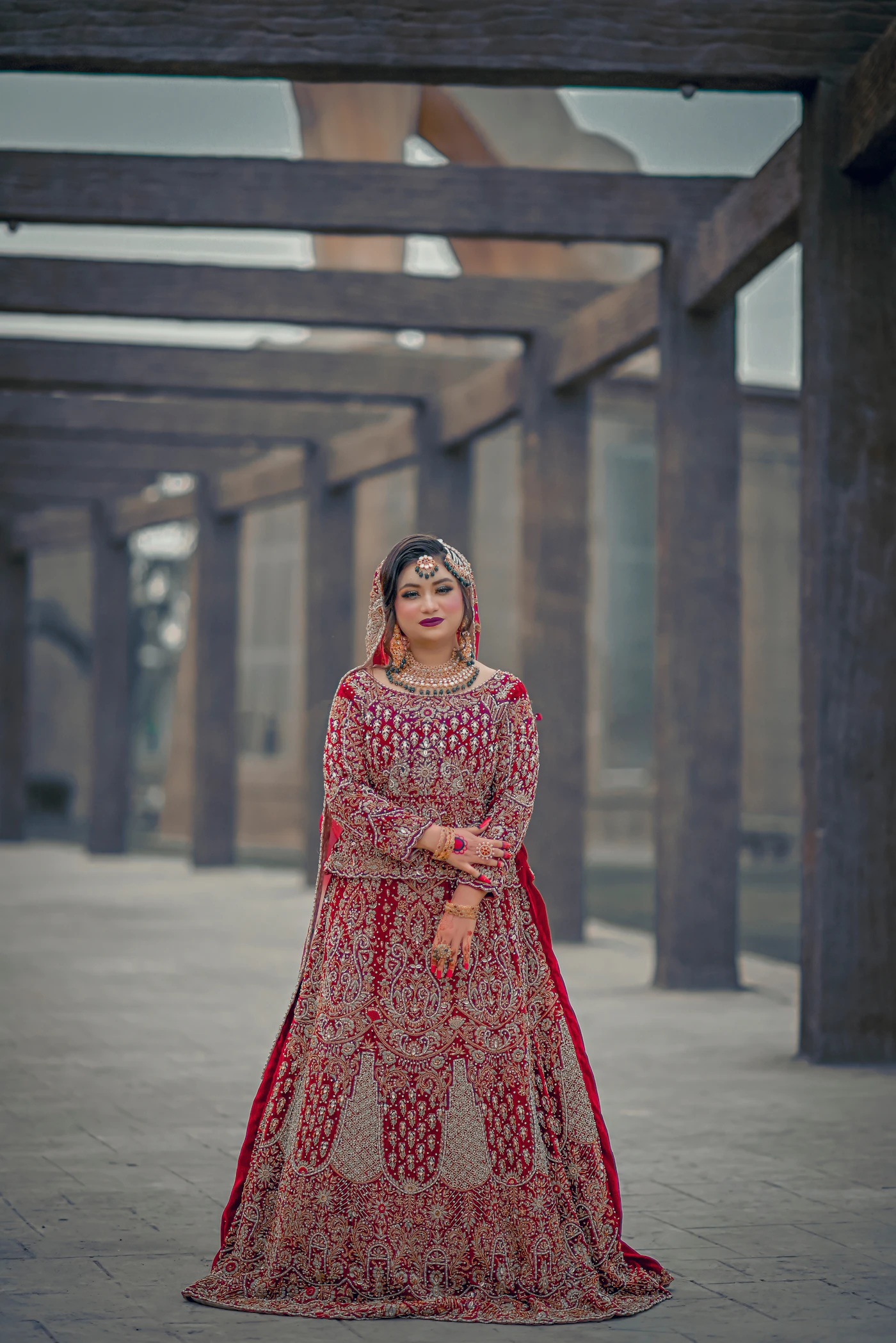 A woman in a red and gold wedding dress