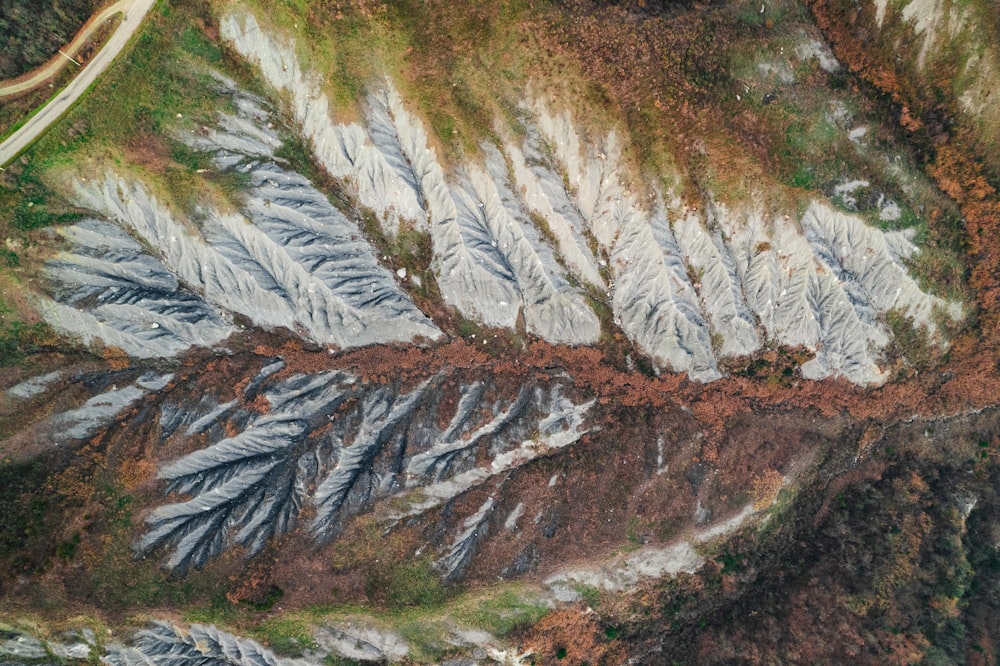 an aerial view of a snow covered mountain