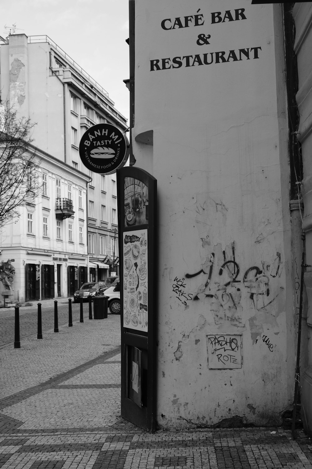 a black and white photo of a cafe and restaurant