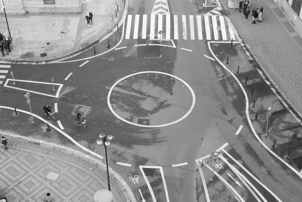 a black and white photo of a street intersection