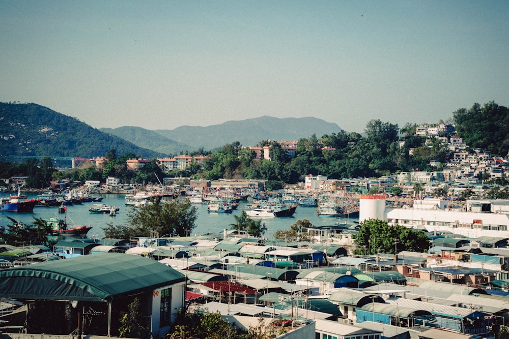 a large group of boats floating on top of a body of water