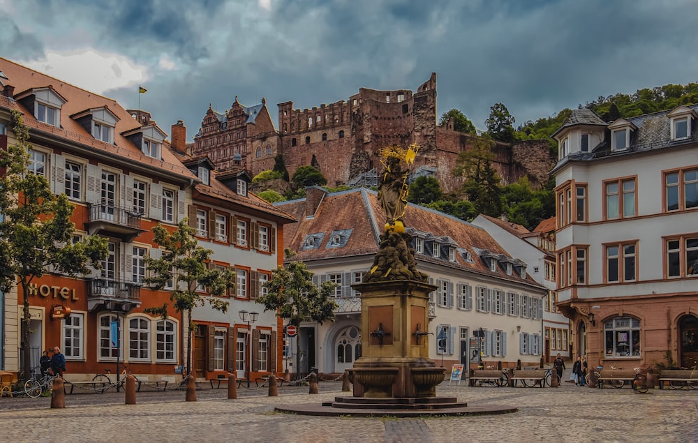 a fountain in the middle of a town square