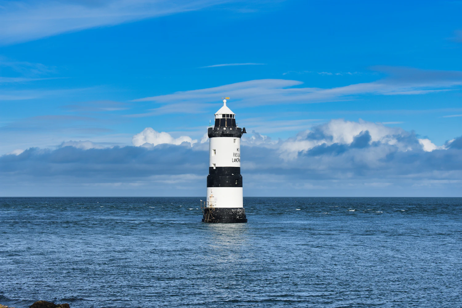 Lighthouse shining out over the sea
