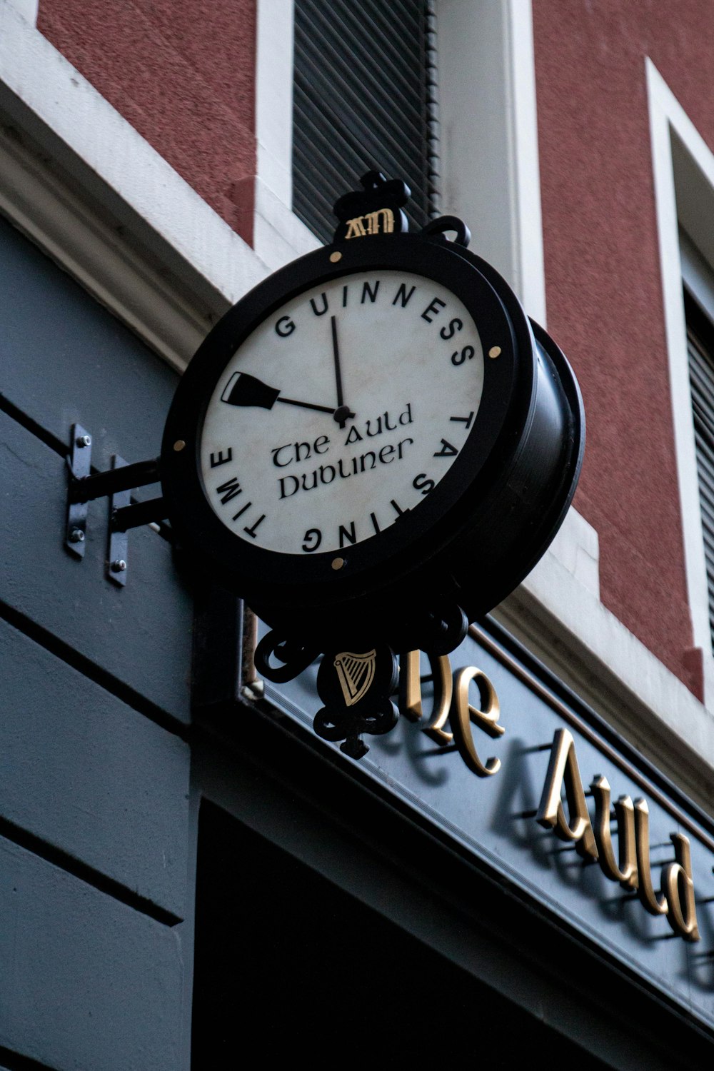 a clock mounted to the side of a building