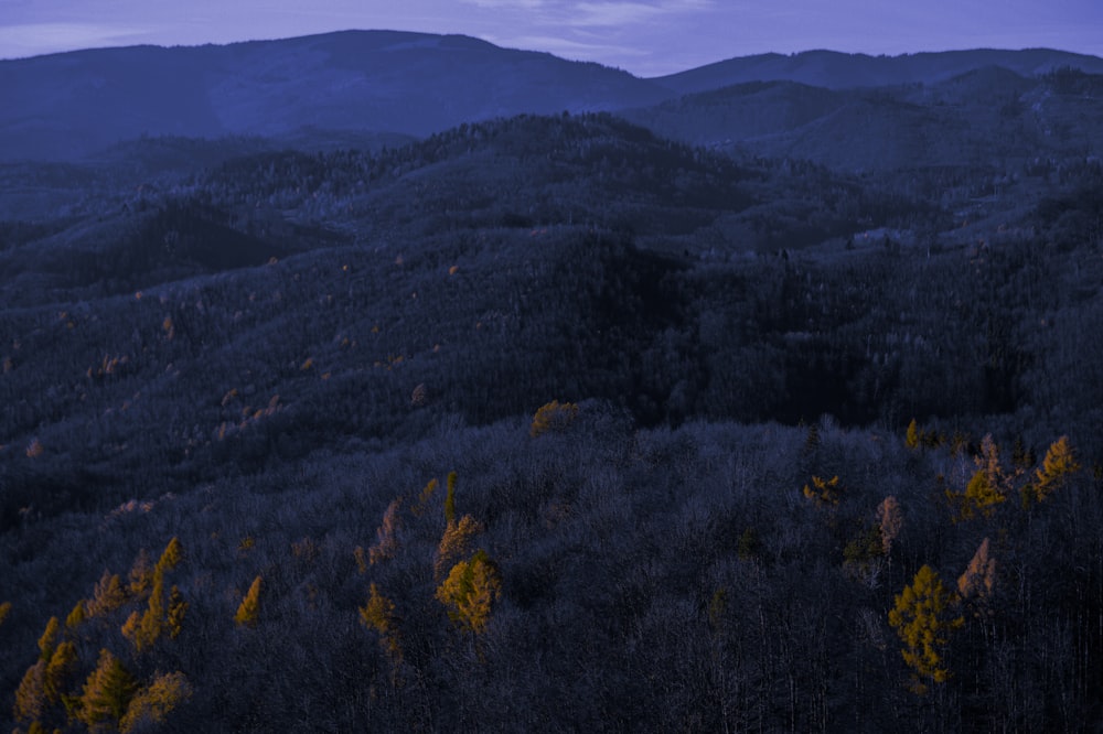 a view of a mountain range at dusk