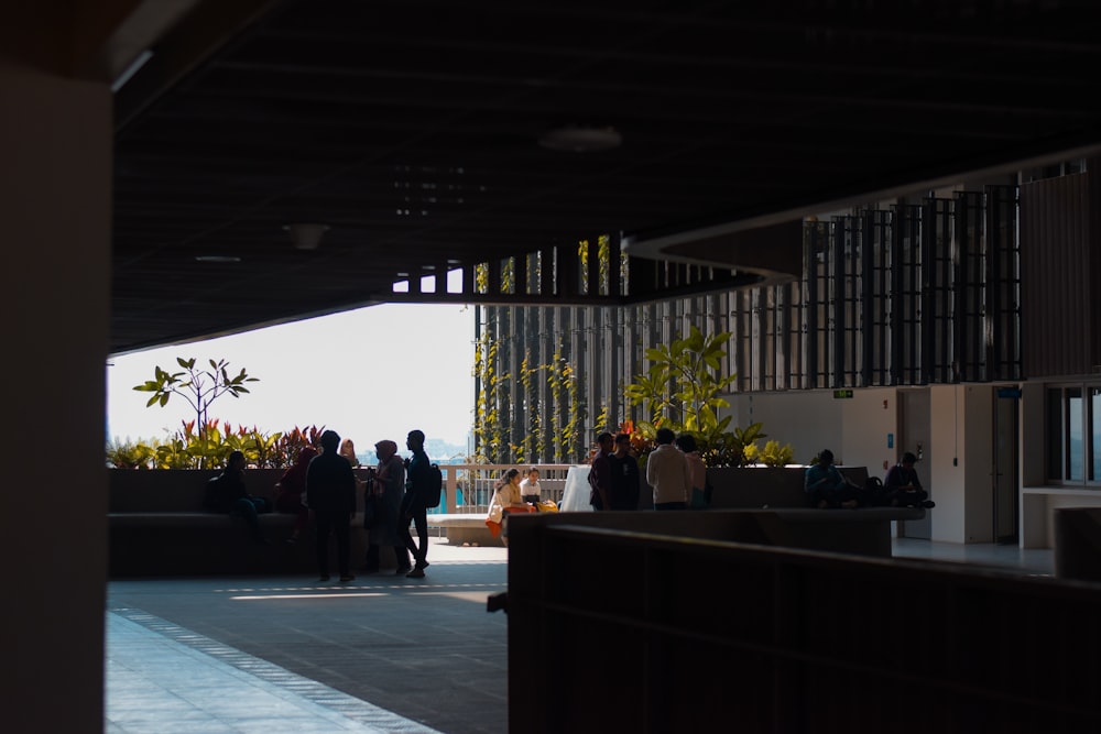 a group of people standing around a building