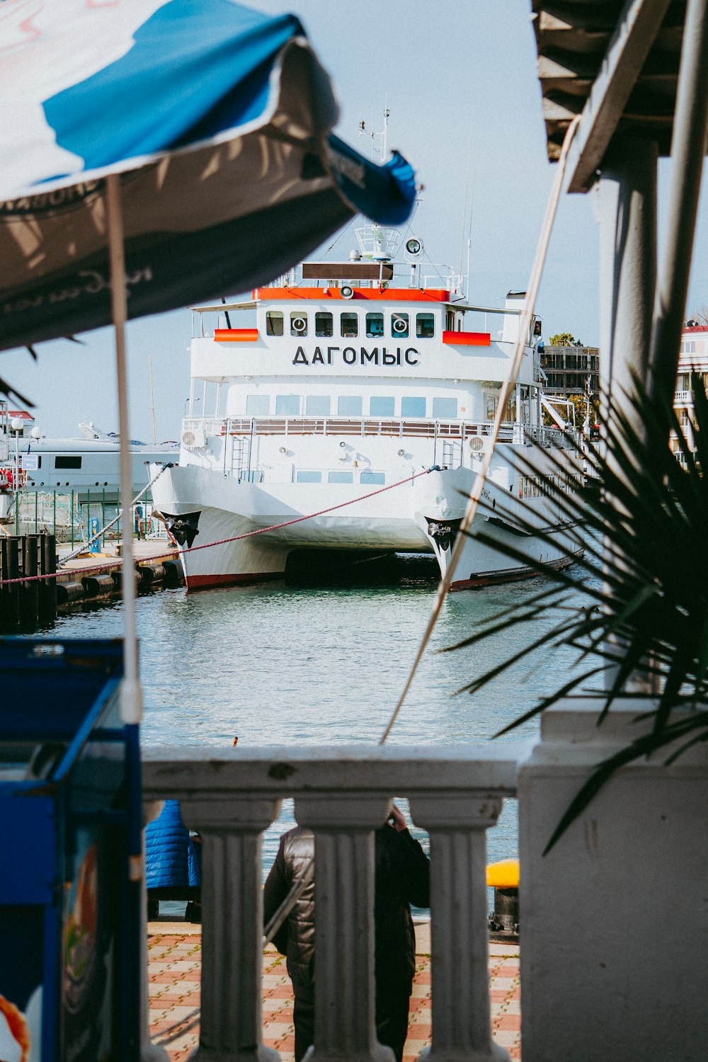 a large boat is docked at a pier