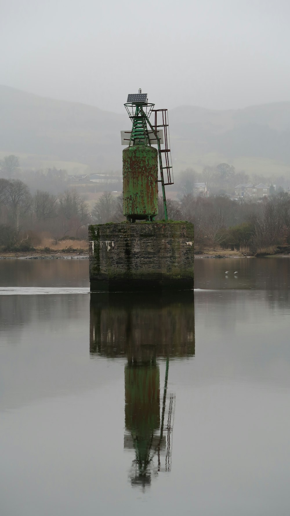 a large body of water with a tower in the middle of it