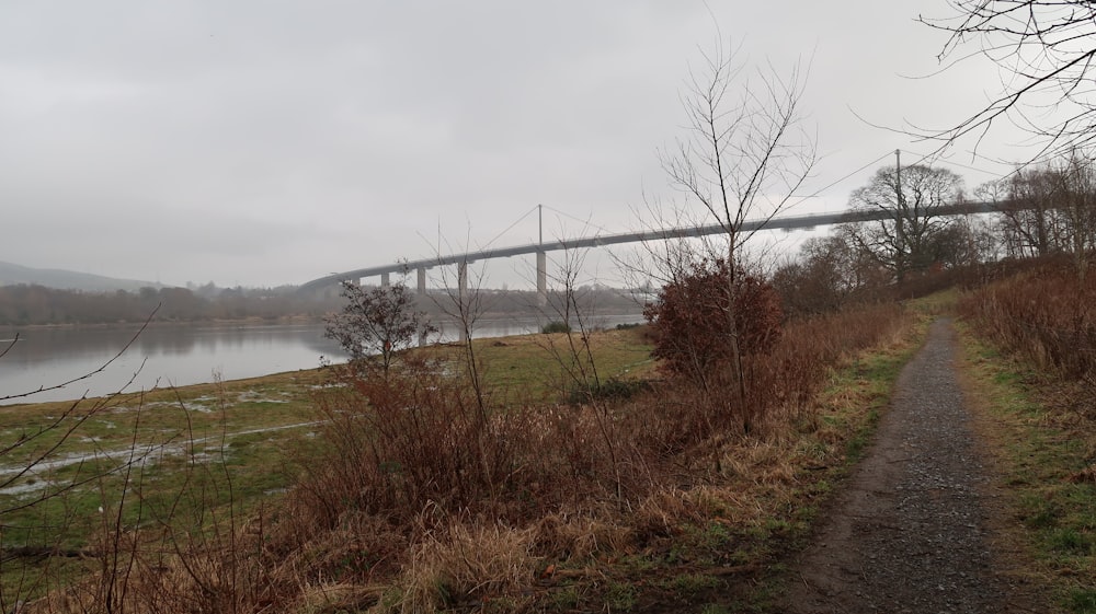 a bridge over a body of water on a cloudy day