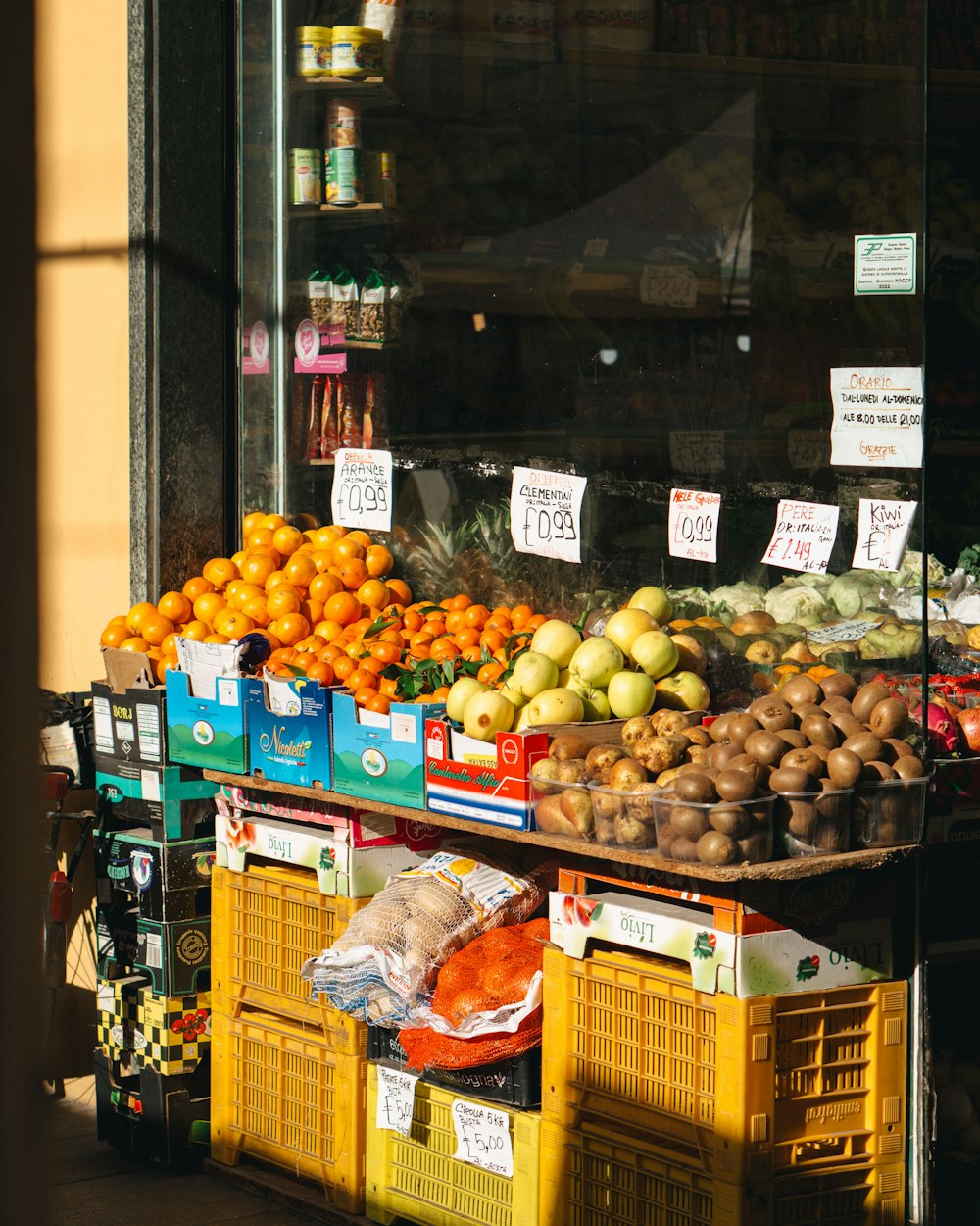 a fruit stand in front of a store