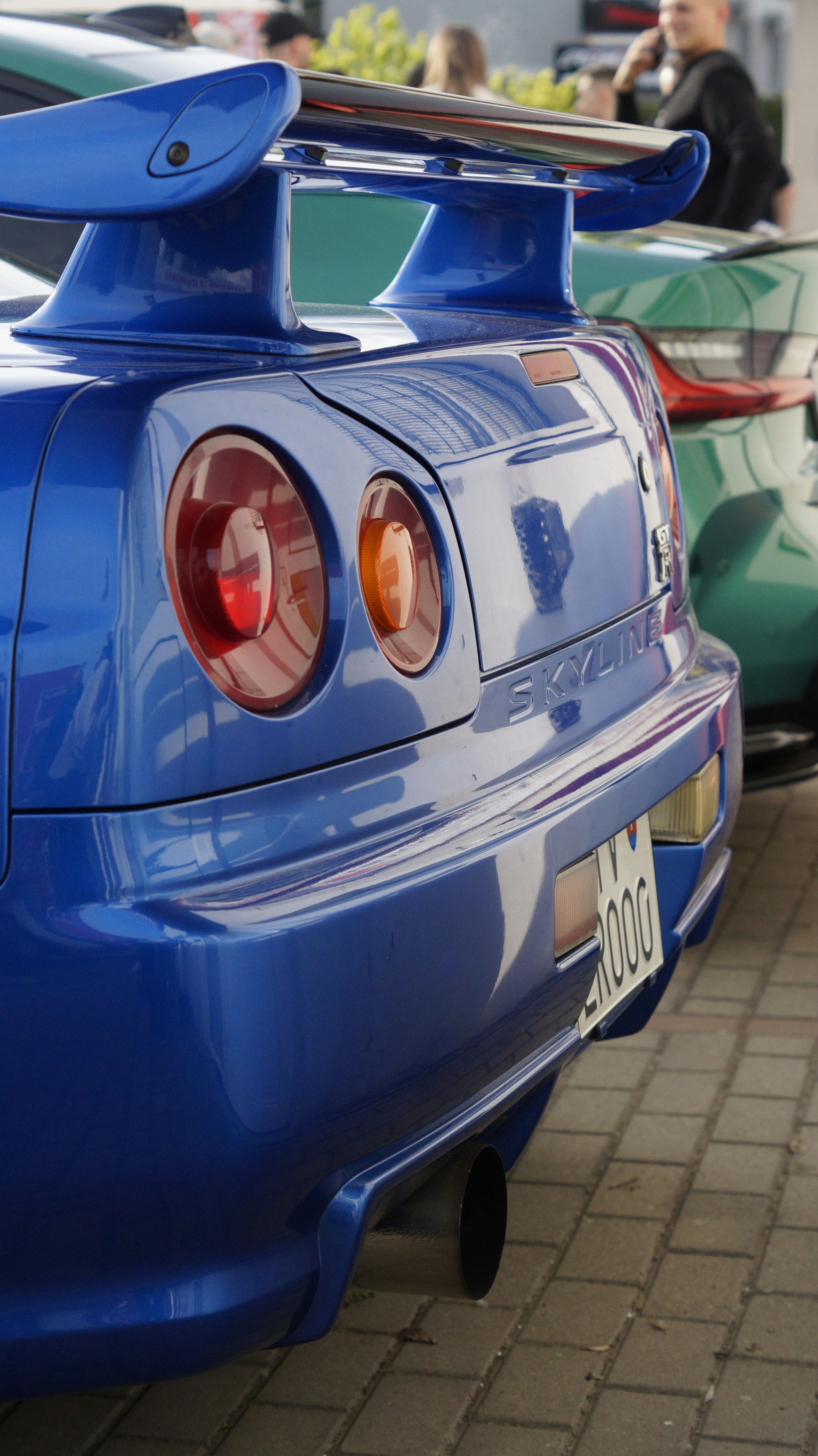 a blue sports car parked in a parking lot