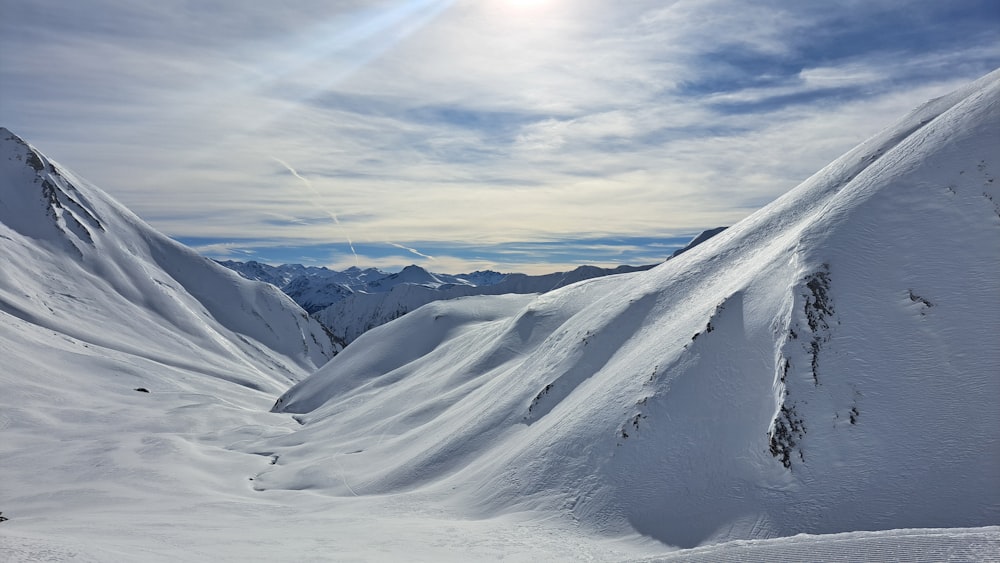 a person skiing down a snow covered mountain