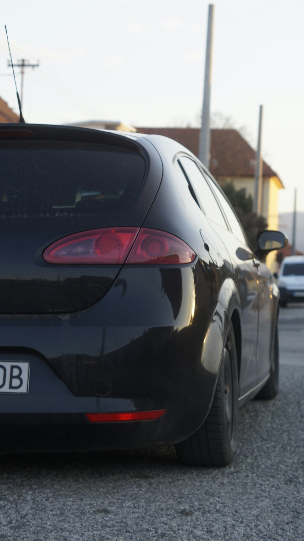 a black car parked on the side of the road