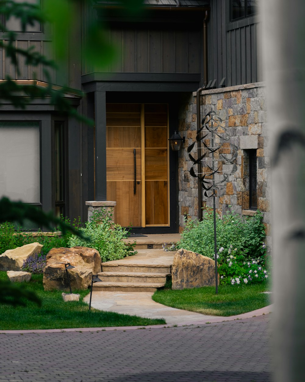 a stone house with a wooden front door