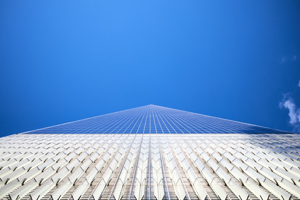 a very tall building with a blue sky in the background