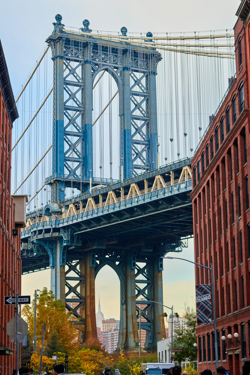 a large bridge spanning over a city street