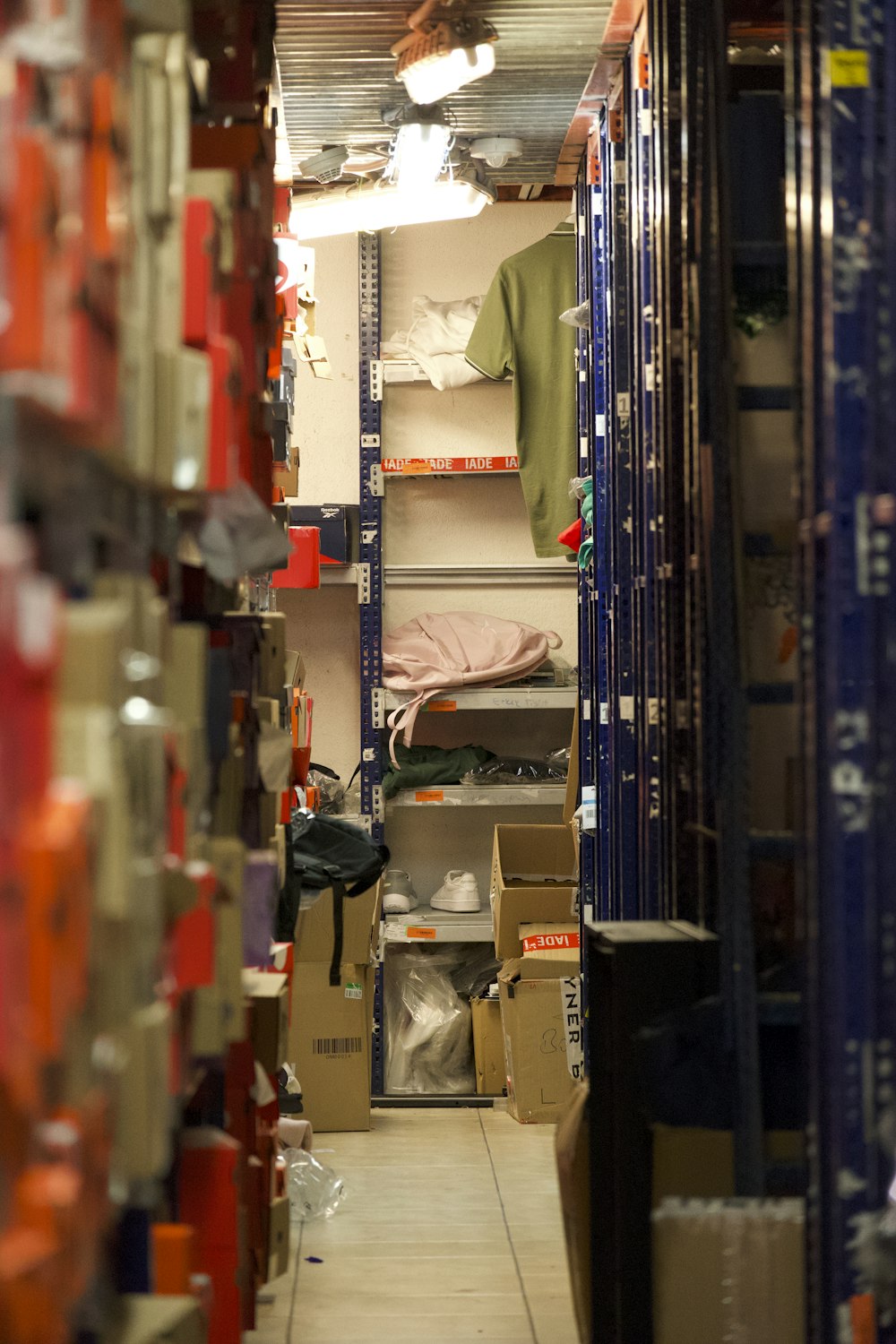 a long narrow room with a lot of shelves