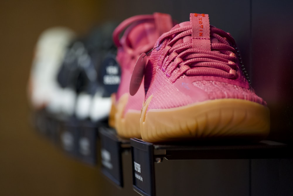 a row of shoes sitting on top of a shelf