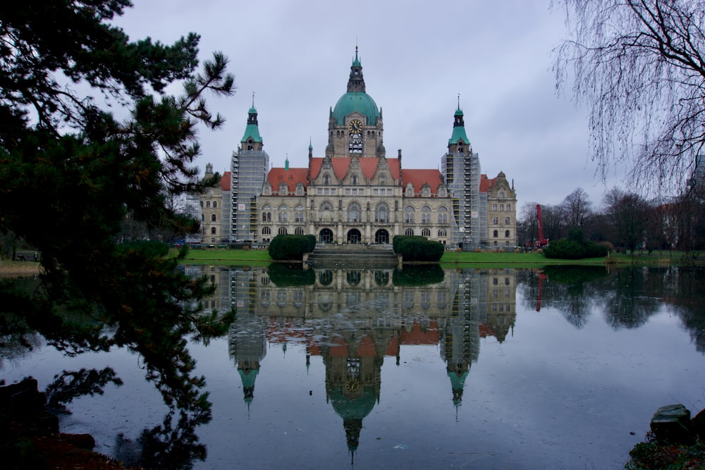 a large building sitting next to a body of water