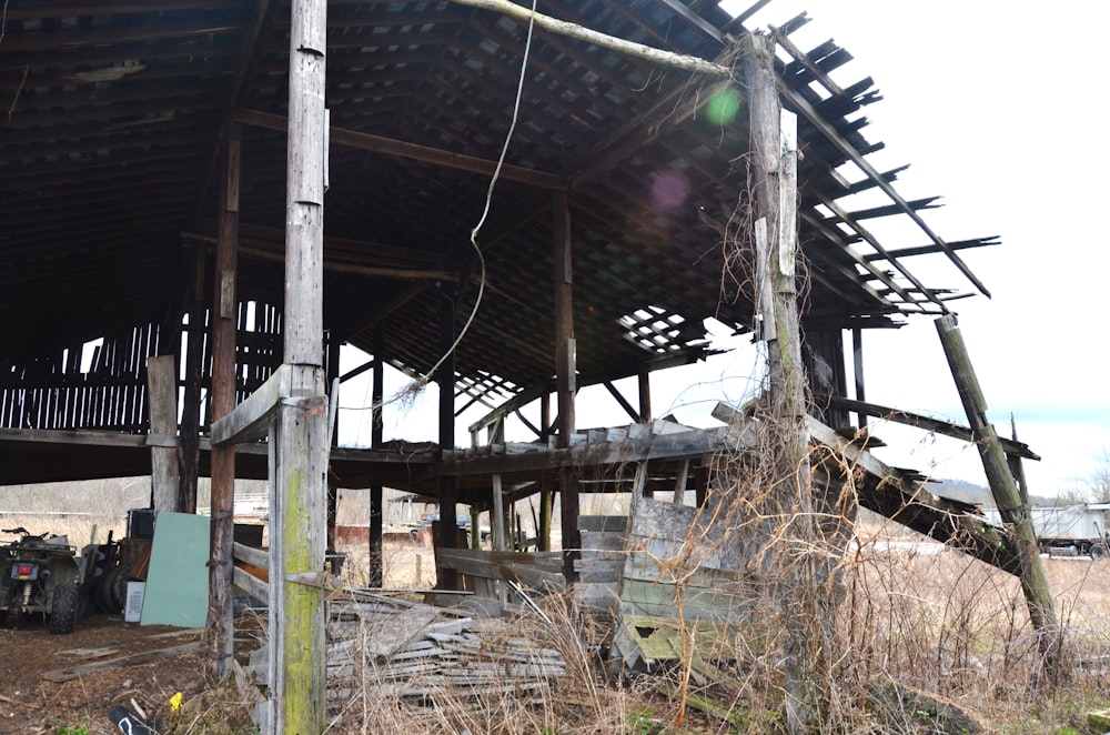 an old wooden structure with a ladder up to it