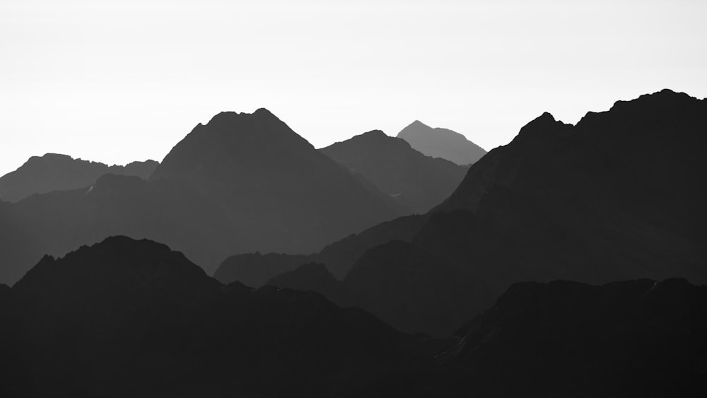 a black and white photo of a mountain range