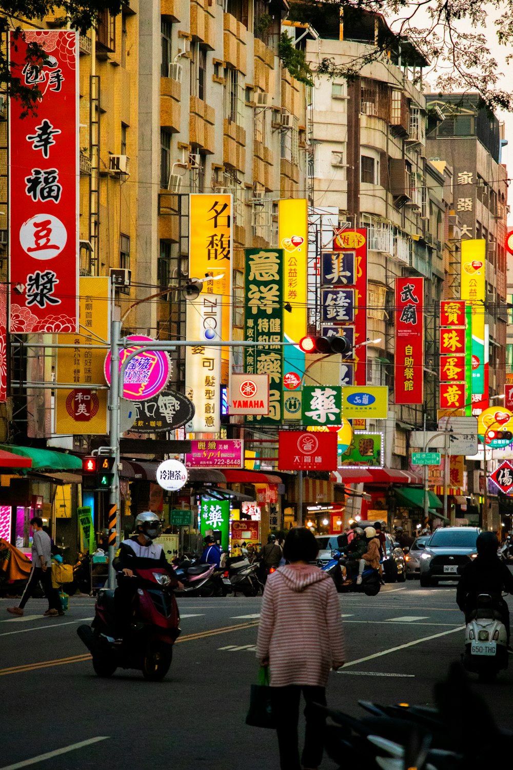 a city street filled with lots of tall buildings