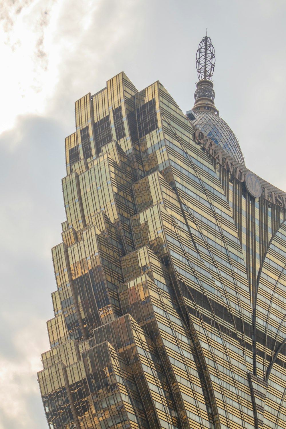 a very tall building with a sky background