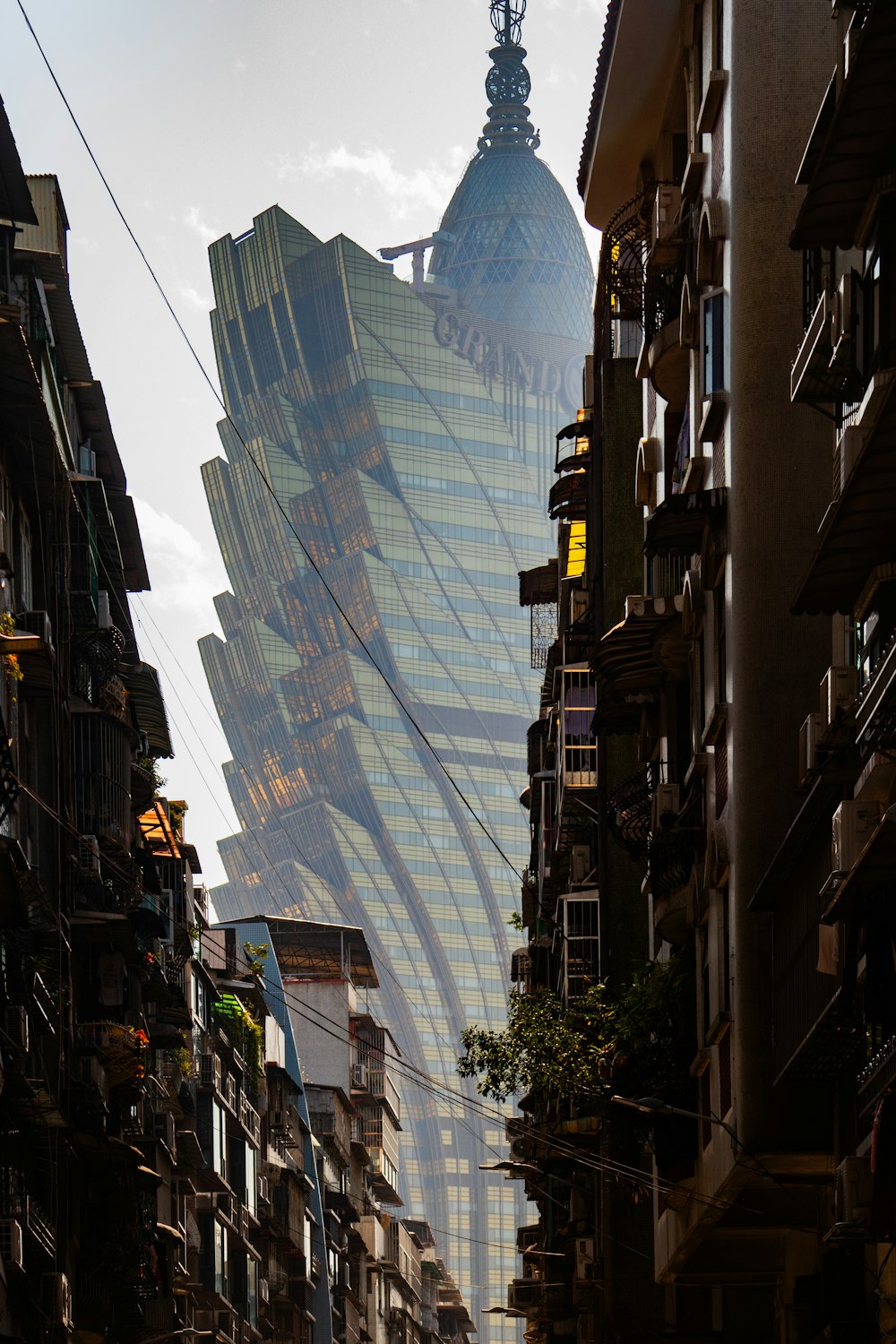 a very tall building towering over a city