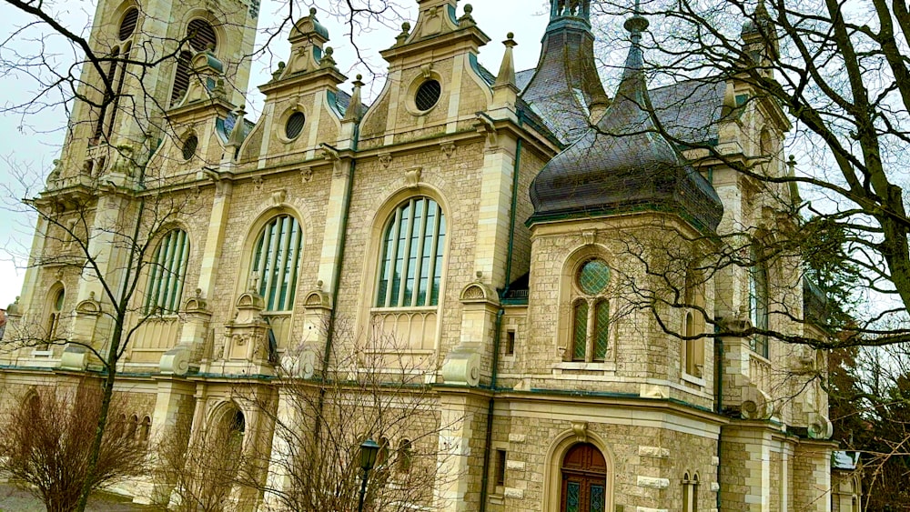 an old church with a clock tower and steeple