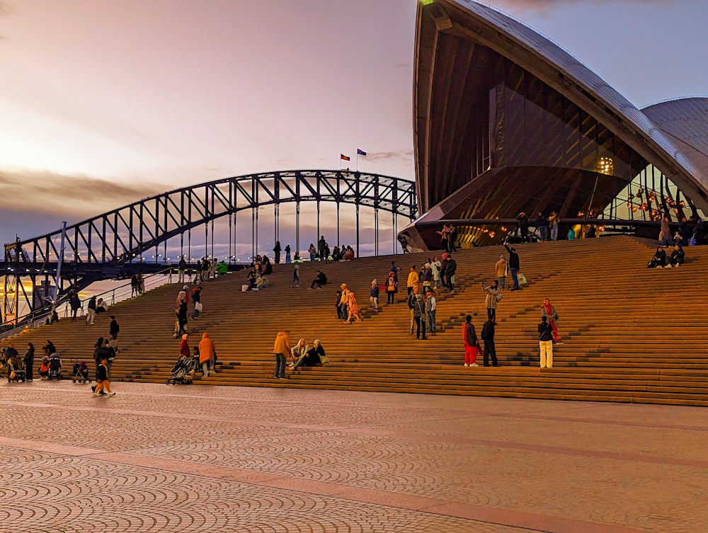 a group of people walking up and down a set of stairs