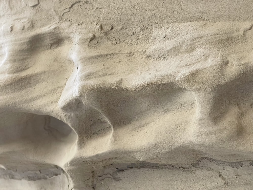 a close up of a wall made of sand