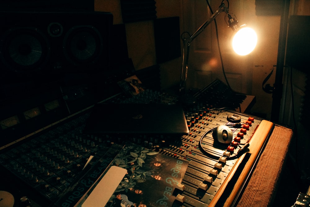 a recording studio with a laptop and sound equipment