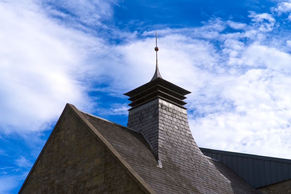 a church steeple with a blue sky in the background