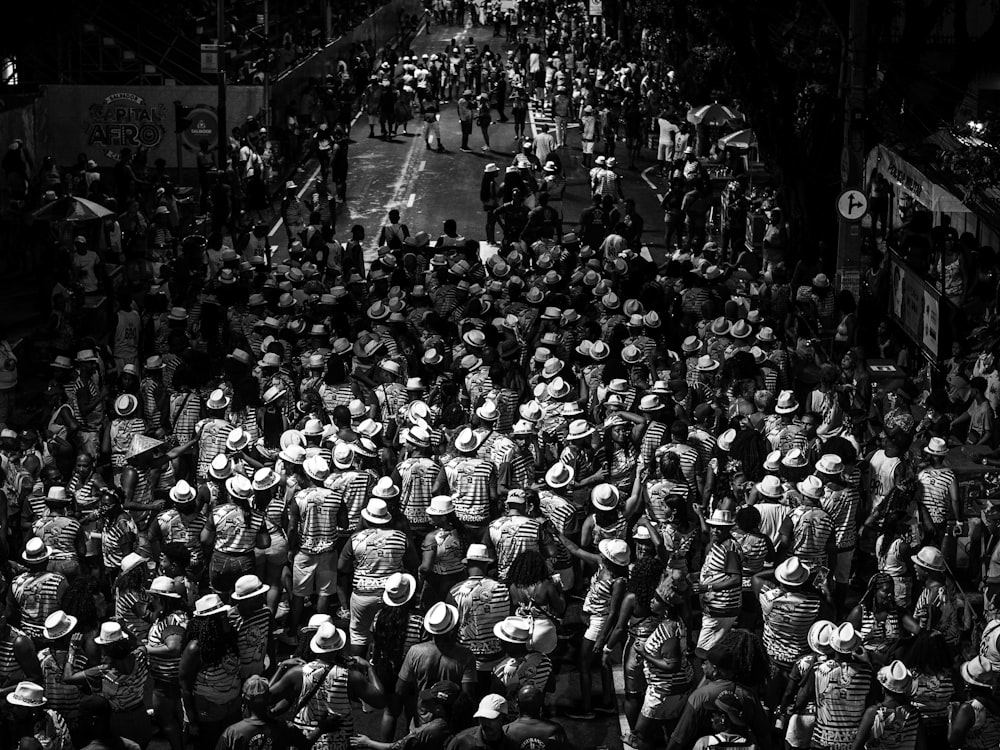 a large group of people walking down a street