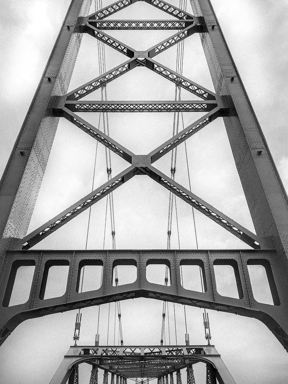 a black and white photo of a bridge