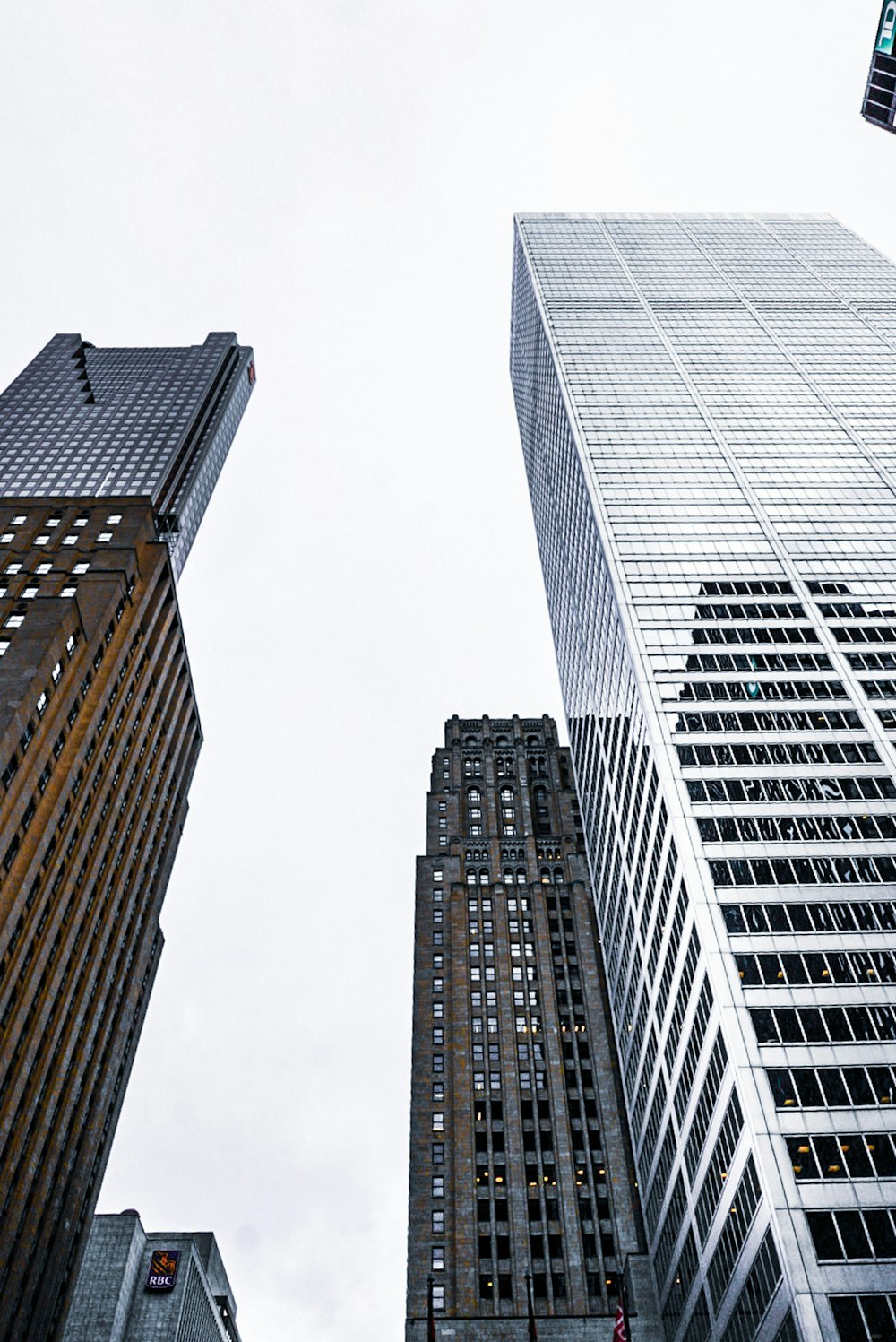 a couple of tall buildings sitting next to each other