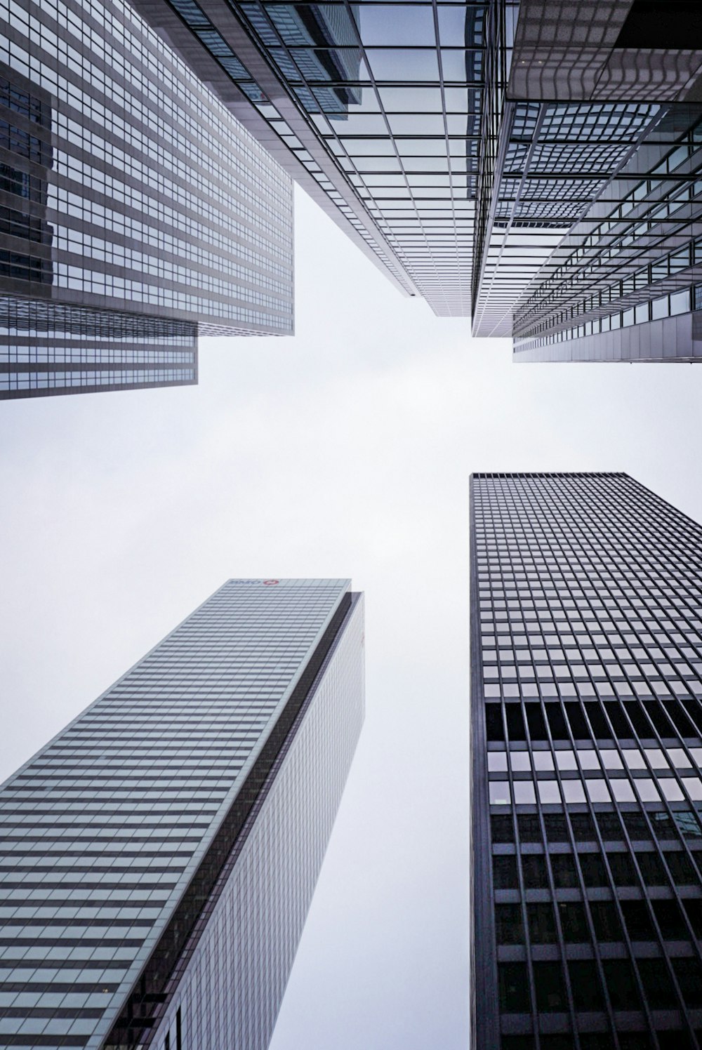 a group of tall buildings with a sky background