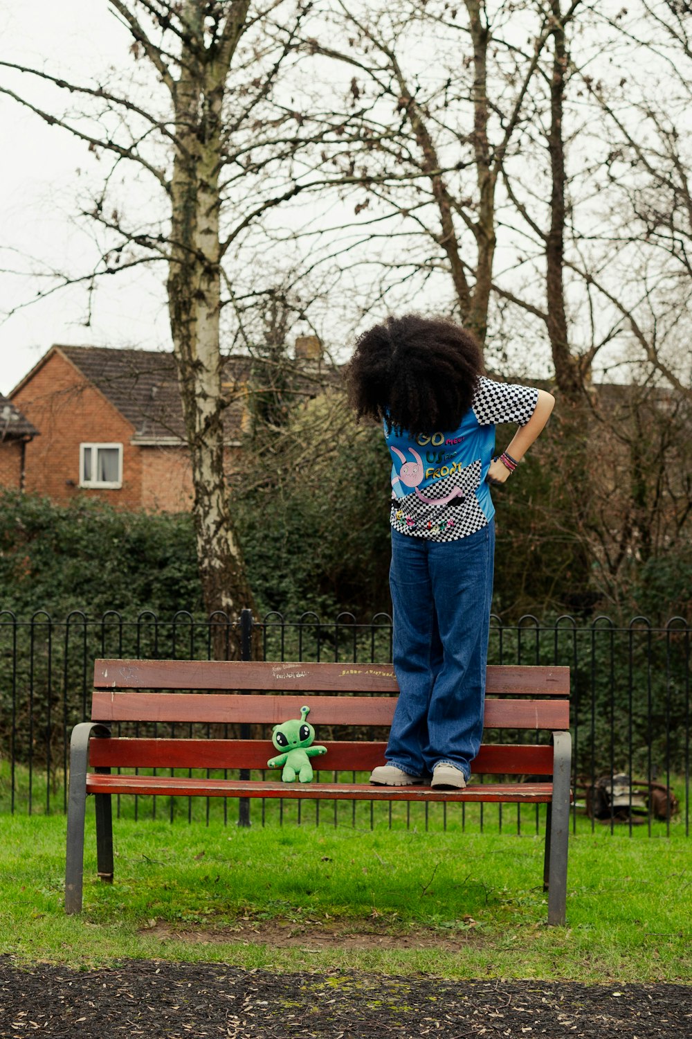 a person standing on top of a wooden bench