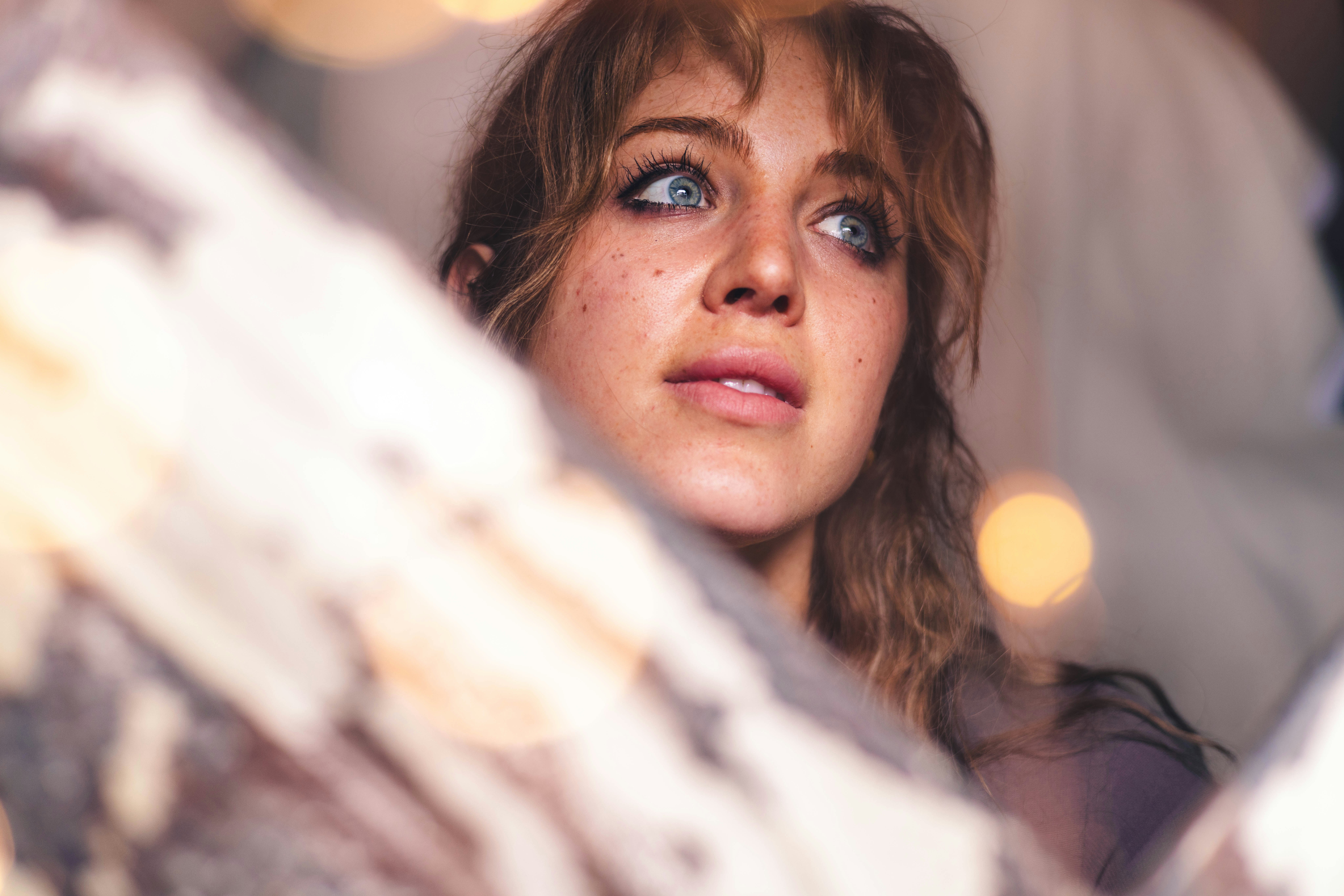 a close up of a person with blue eyes