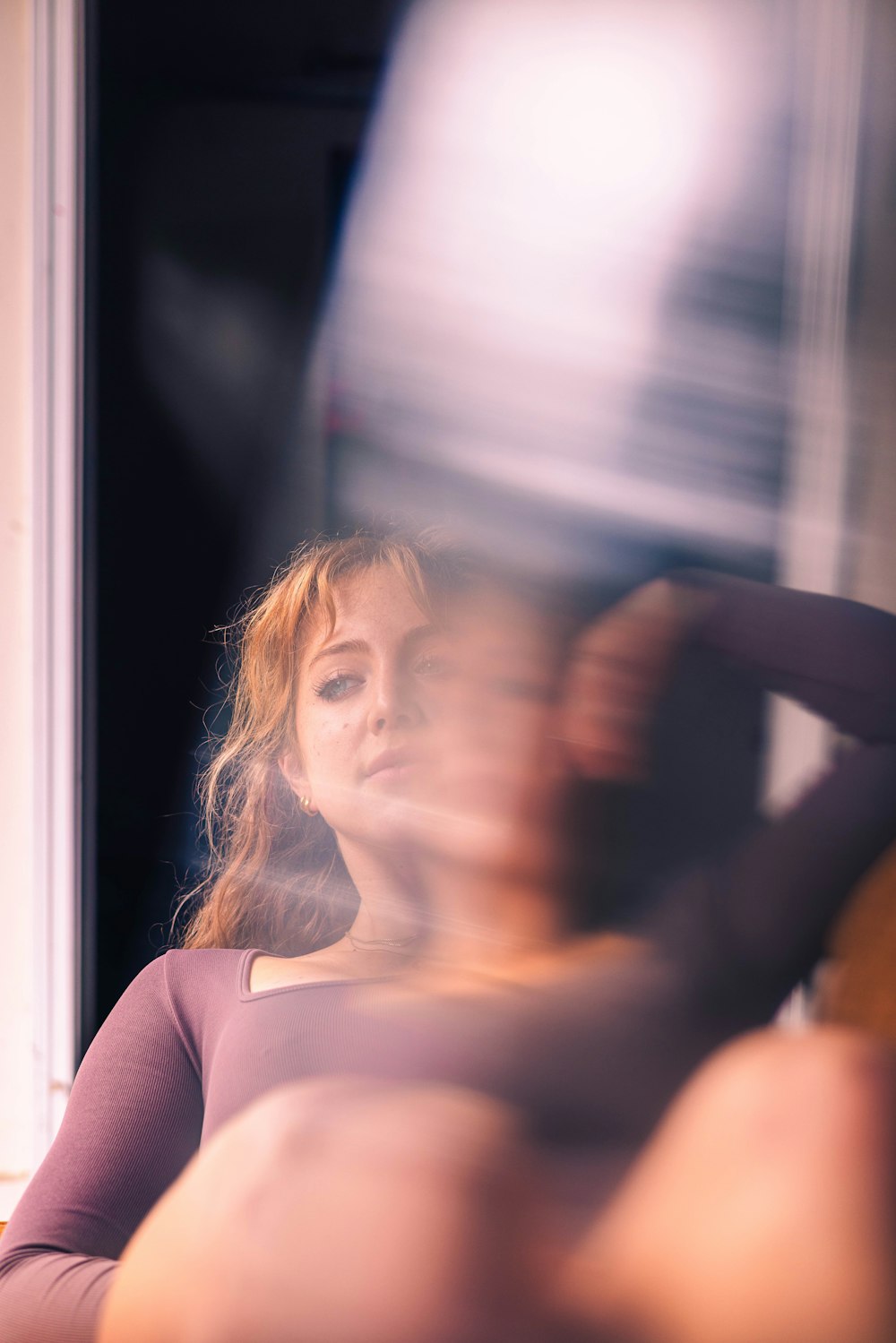 a blurry photo of a woman holding a guitar