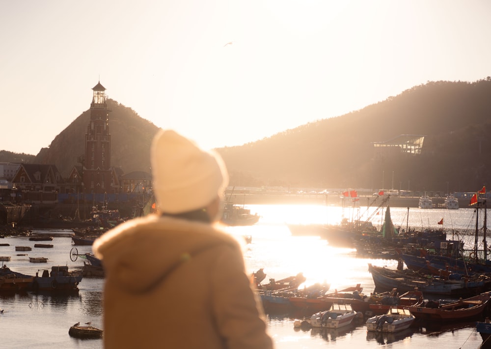 a person standing in front of a body of water