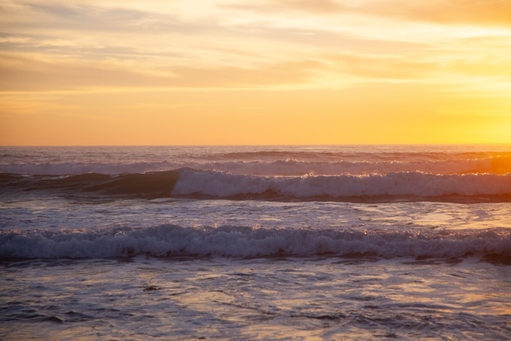 a person riding a surfboard on a wave in the ocean