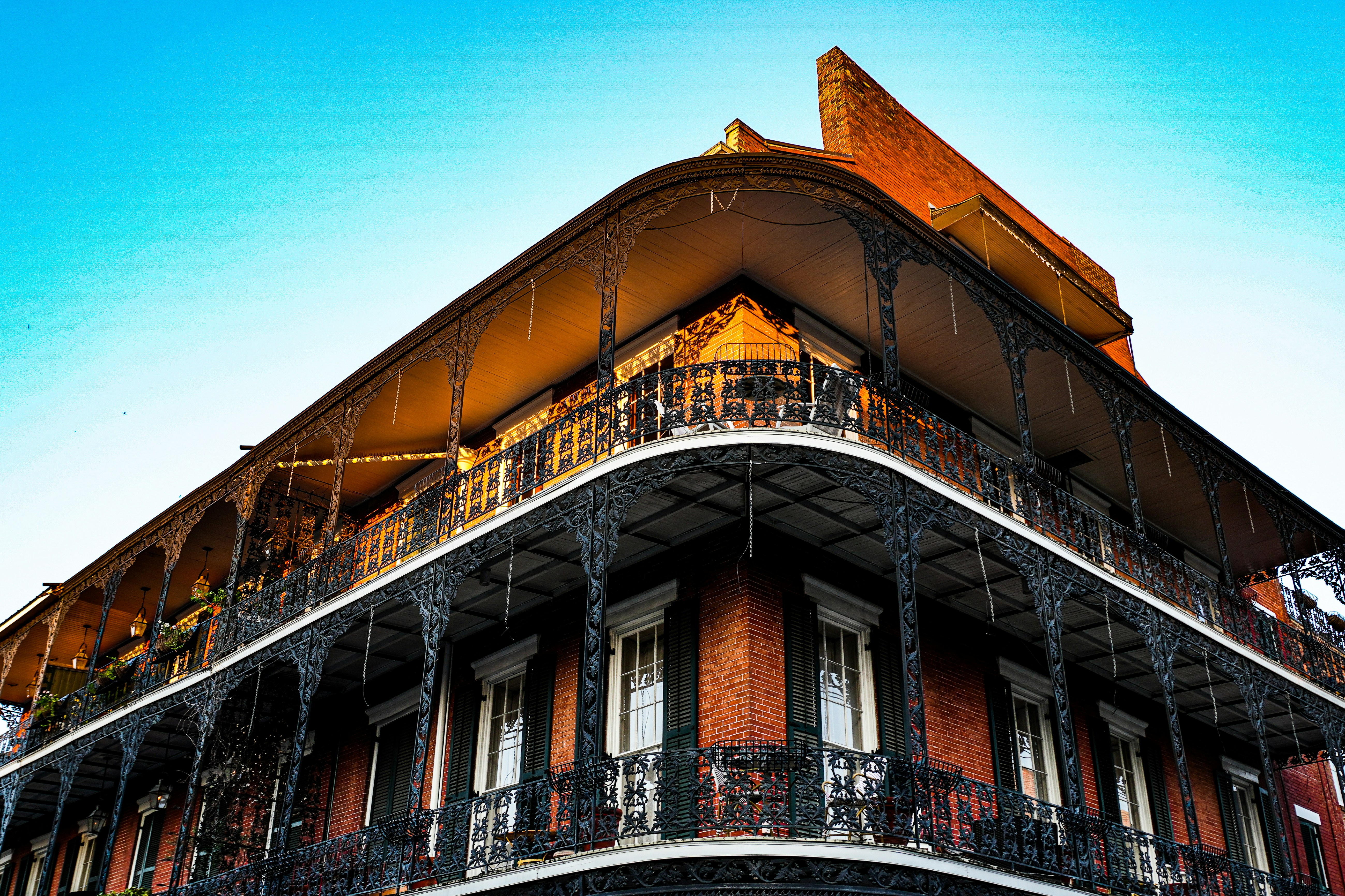 a tall building with balconies and wrought iron railings