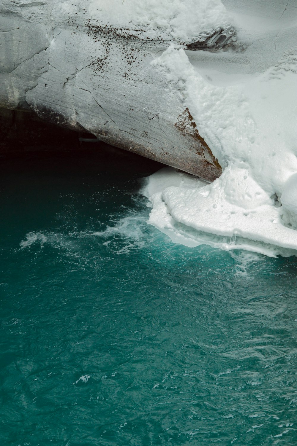 a large iceberg floating in a body of water