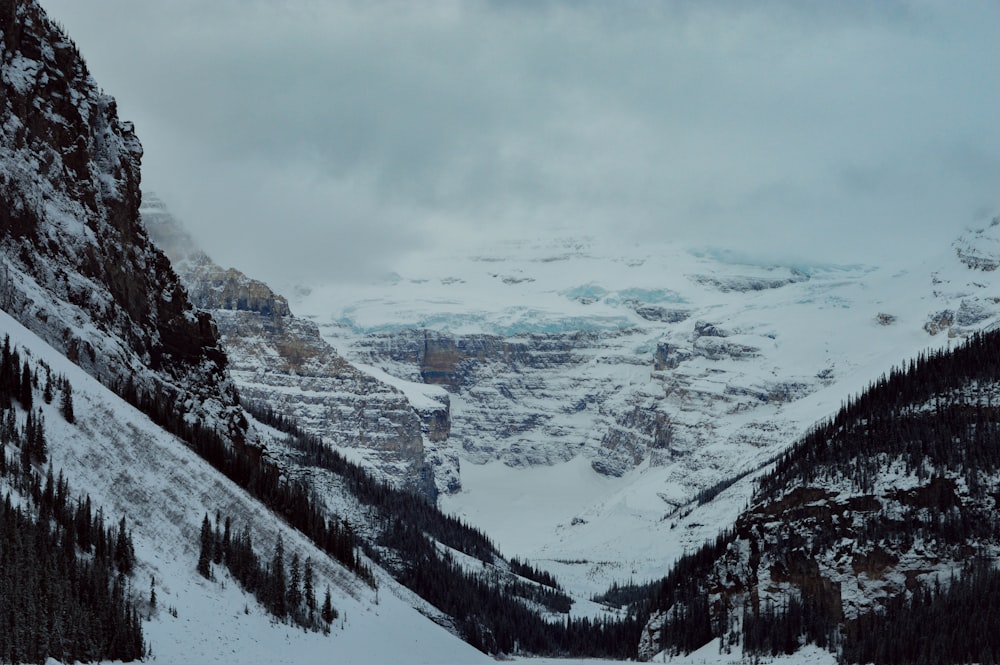 a snow covered mountain with a river running through it